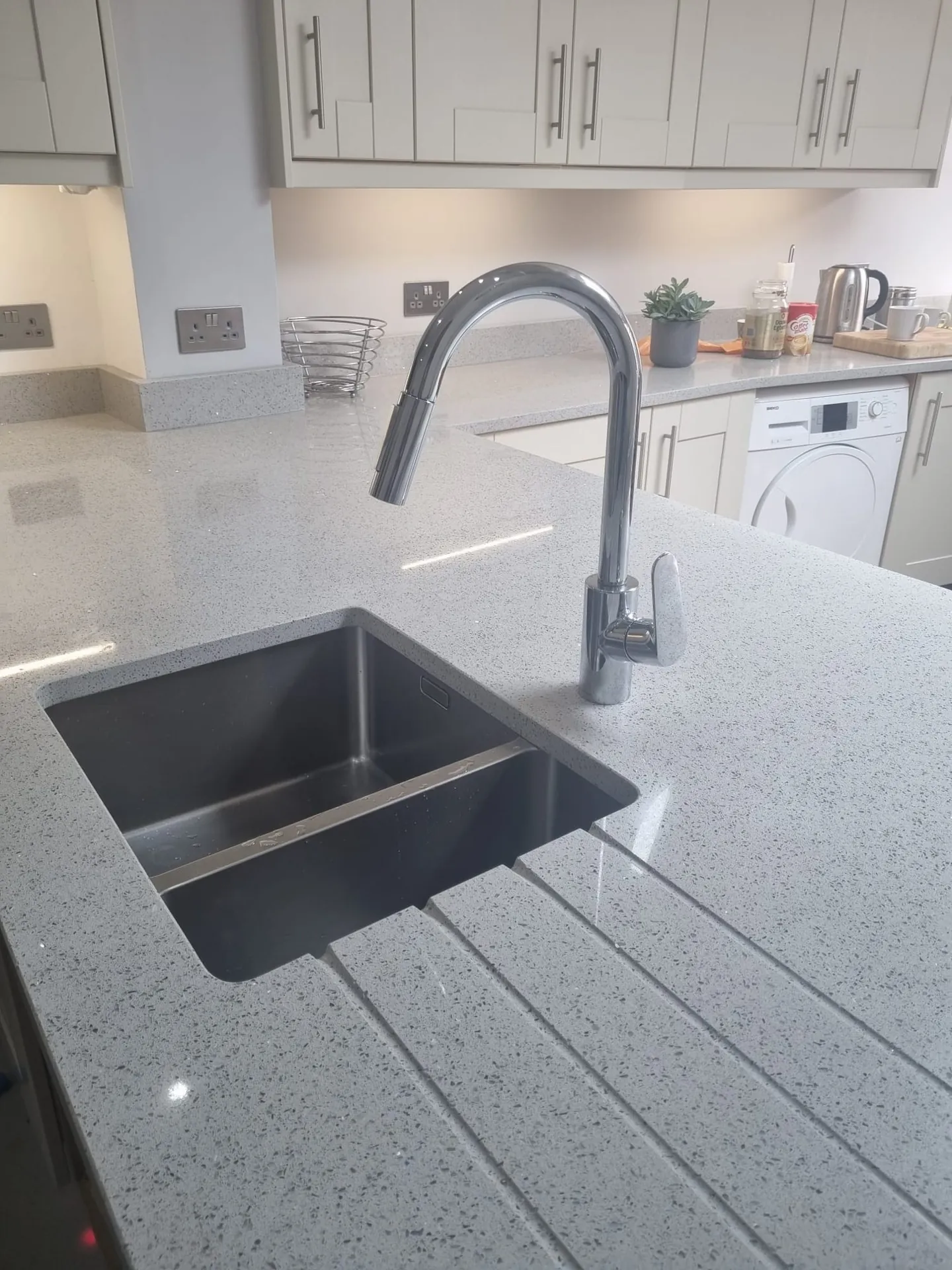 New chrome kitchen tap fitted by a plumber in Romford