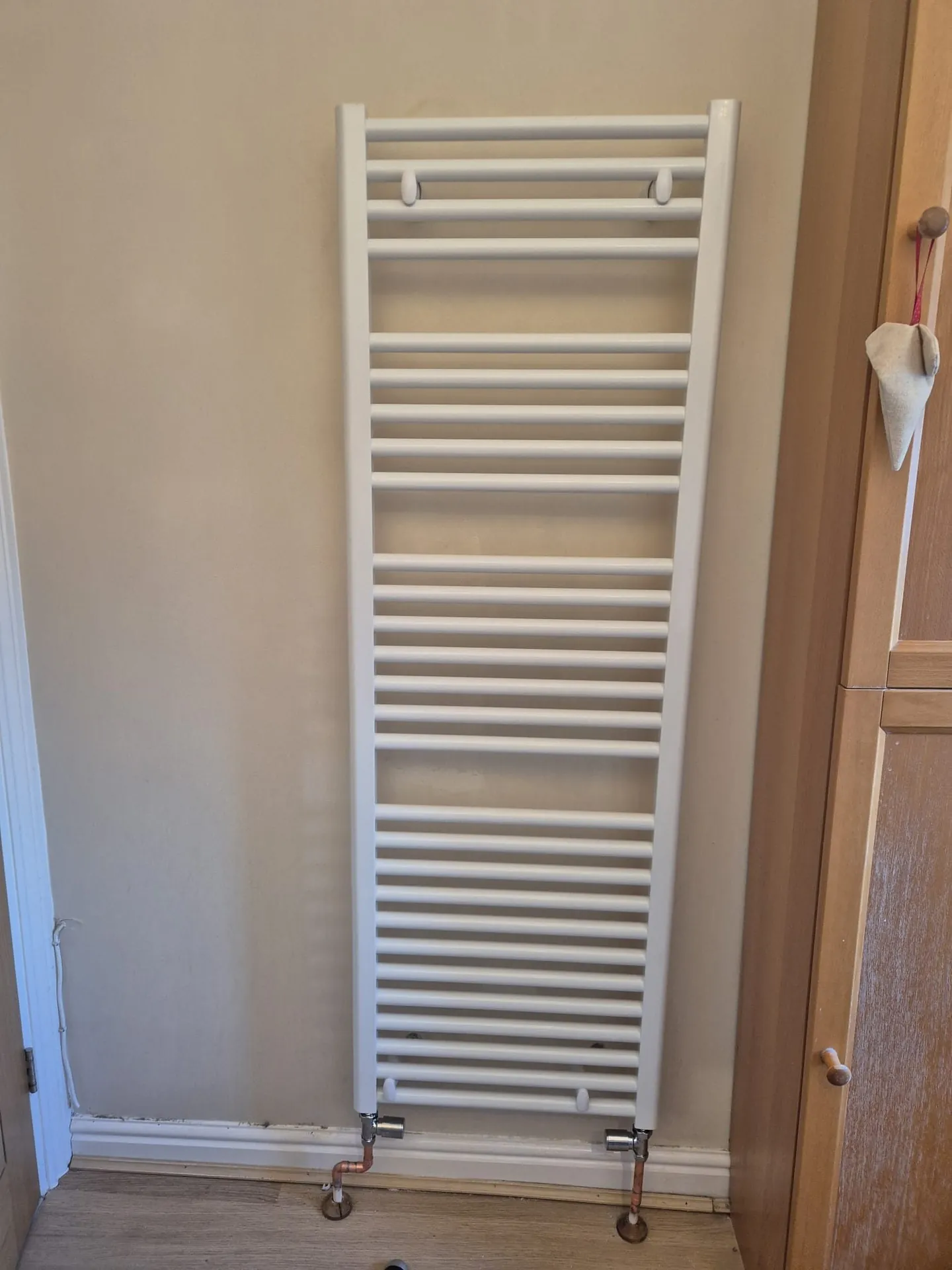 Heated towel radiator installed in a Romford bathroom