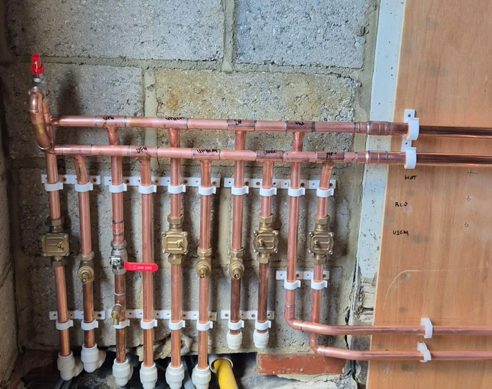 Neatly installed central heating pipework and valves in Romford